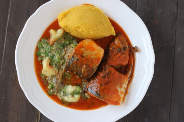 Nigerian mackerel Titus fish stew with yellow garri eba plain okro